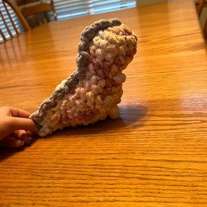 Homemade Dino plushie body is a mix of different pinks and spikes are gray.
